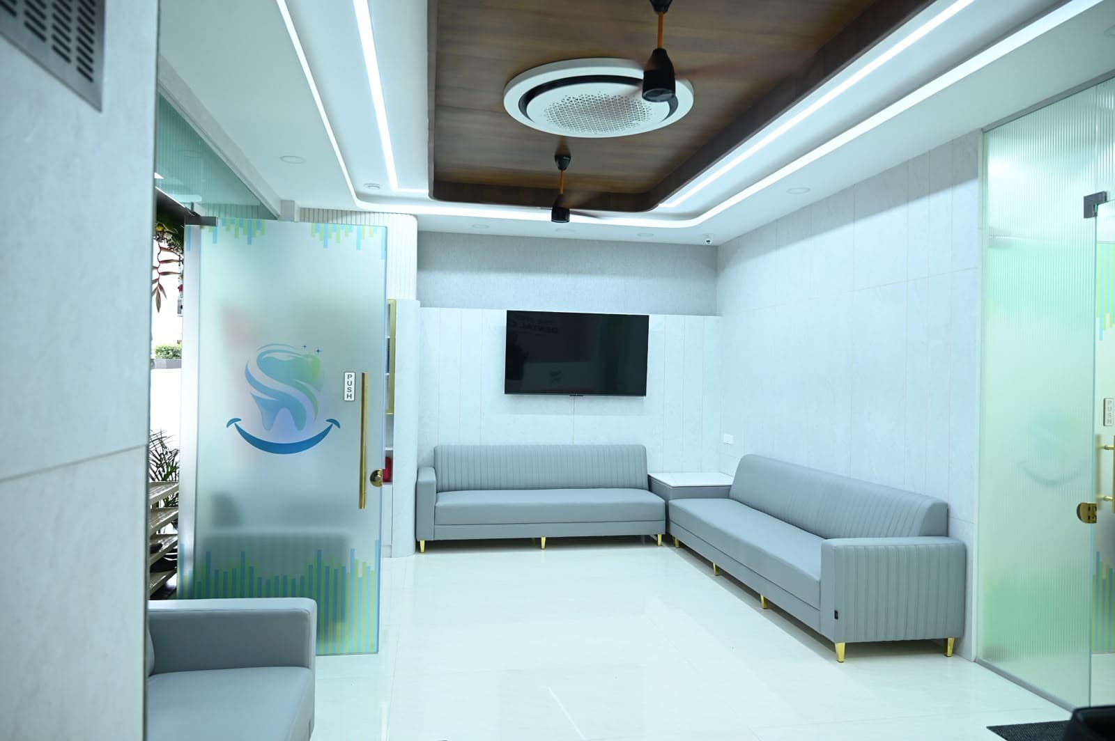The waiting lounge with comfortable grey sofas